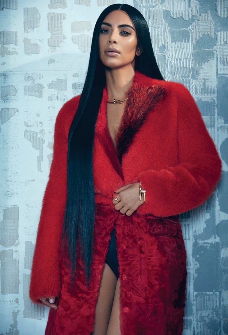 Kim Kardashian poses in red Givenchy fur coat