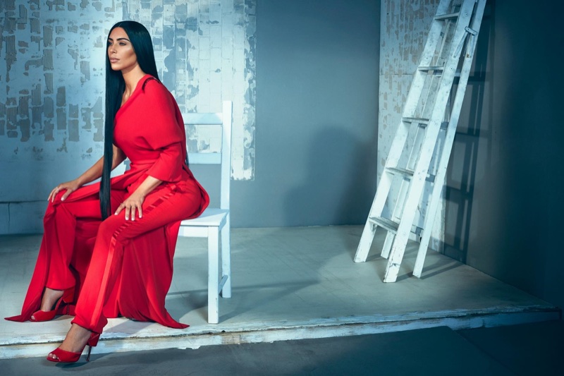 Dressed in red, Kim Kardashian wears Givenchy dress, trousers and heels