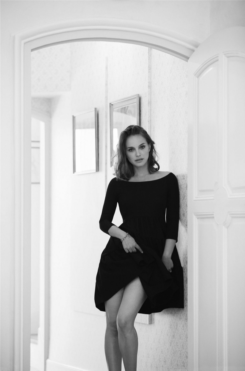 Photographed in black and white, Natalie Portman wears a cocktail dress