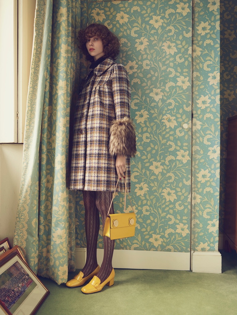 Lorena Maraschi wears a plaid coat in Orla Kiely's fall-winter 2017 campaign