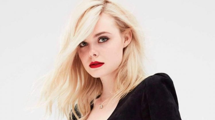 Clad in black, Elle Fanning poses in Saint Laurent dress with Chanel jewelry