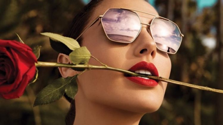 Actress Gal Gadot poses with a red rose for Erroca eyewear campaign