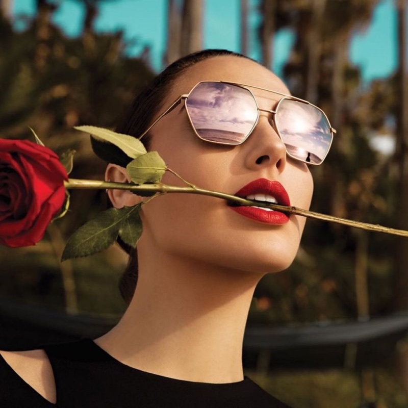 Actress Gal Gadot poses with a red rose for Erroca eyewear campaign