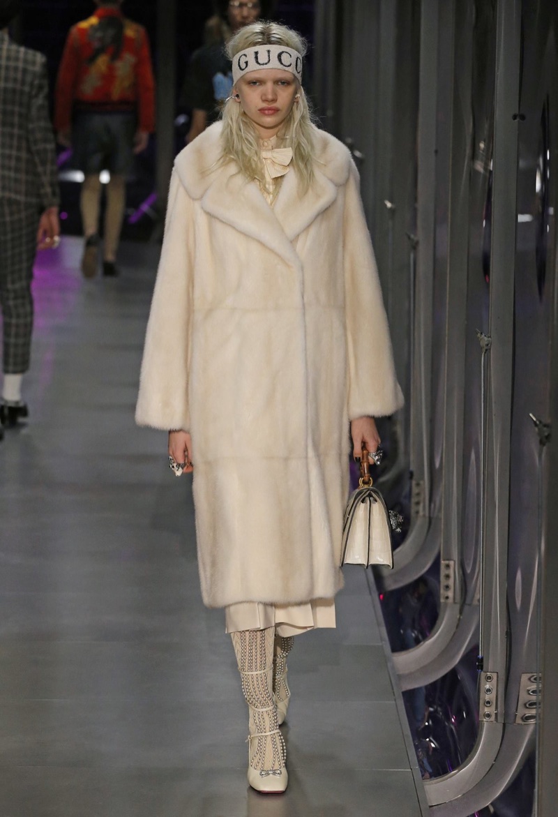 Model wears fur coat on Gucci's fall-winter 2017 runway