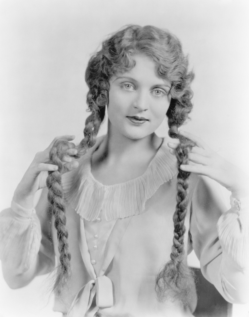 Long hair was also popular in the 1920s. Here's a woman with waves and braided pigtails. Photo: Shutterstock.com