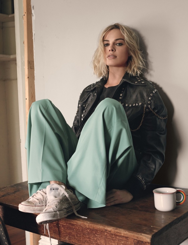 Margot Robbie poses in Gucci leather jacket, Zadig & Voltaire shirt, Chloe pants and Converse sneakers
