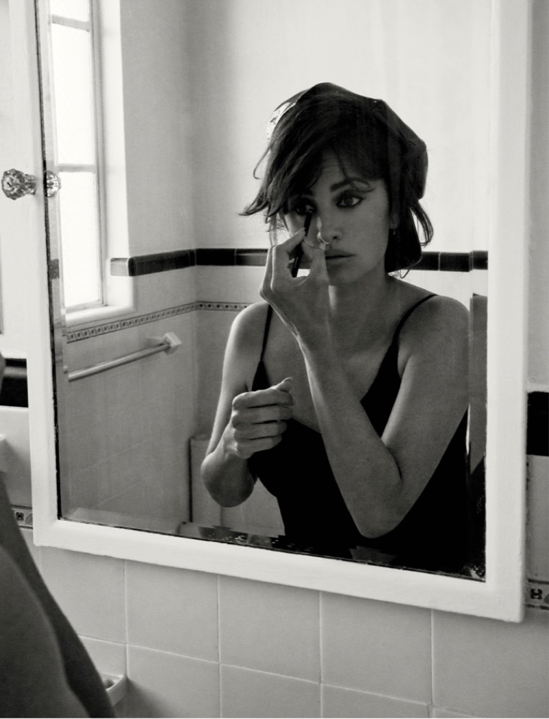 Looking in the mirror, Penelope Cruz wears Miu Miu hat and dress