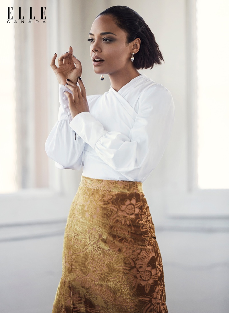 Tessa Thompson poses in Erdem shirt and skirt with Sophie Buhai earrings