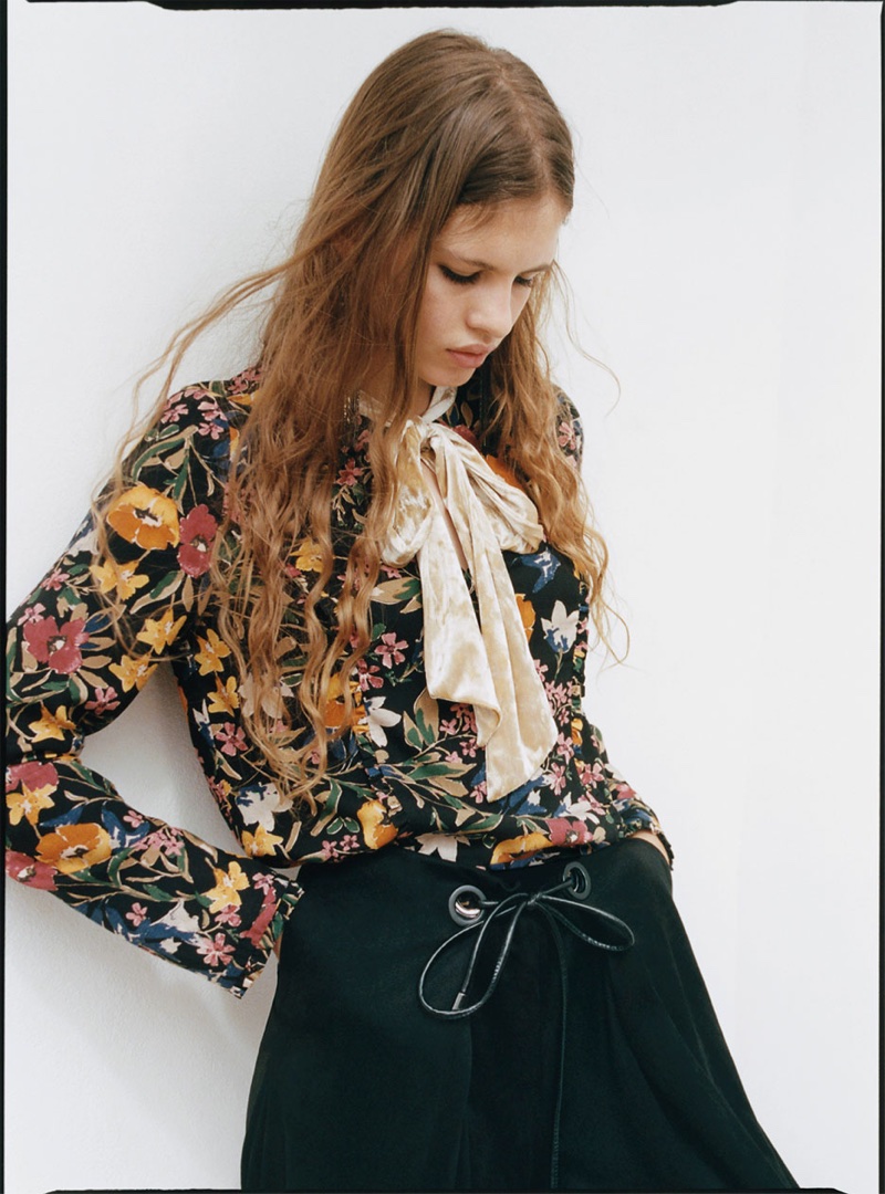 Model wears Zara printed top with bow and faux suede culottes