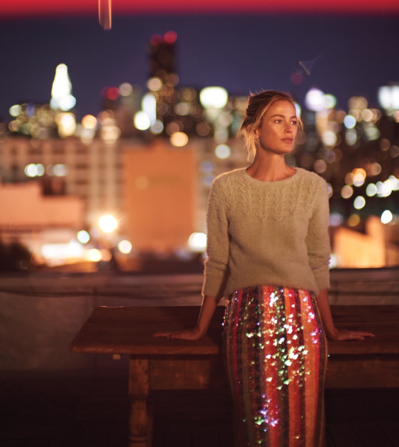 Carolyn Murphy models knit sweater and sequined skirt from Anthropologie’s November 2017 catalog