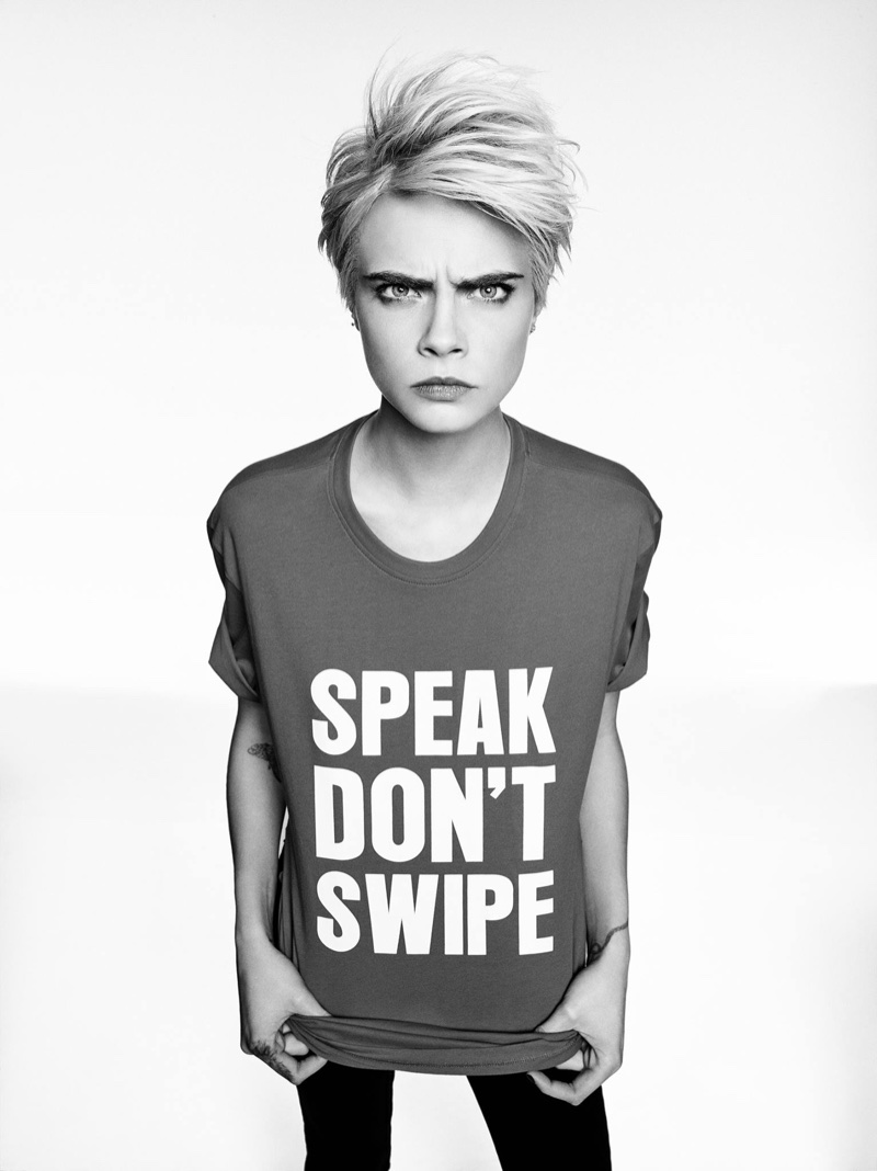 Model Cara Delevingne poses in Armani Exchange Speak Don't Swipe tee