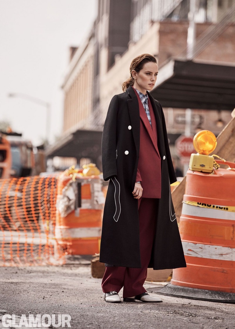 Actress Daisy Ridley wears Emporio Armani coat, Celine jacket and trousers with J. Crew shirt and Altuzarra brogues