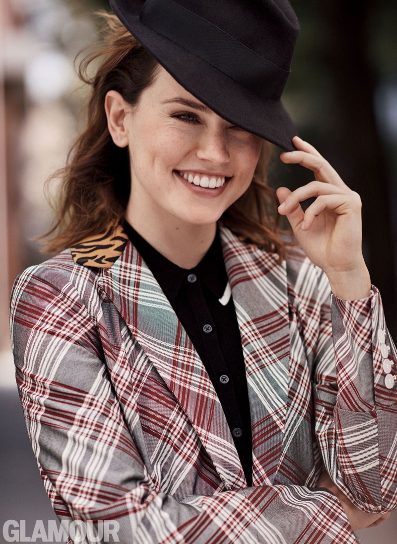 Flashing a smile, Daisy Ridley wears John Galliano coat, Sunday Best for Aritizia dress and East Village Hats fedora