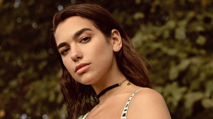 Dua Lipa poses in Dior bralette and choker with Martine Rose shirt and Joseph trousers
