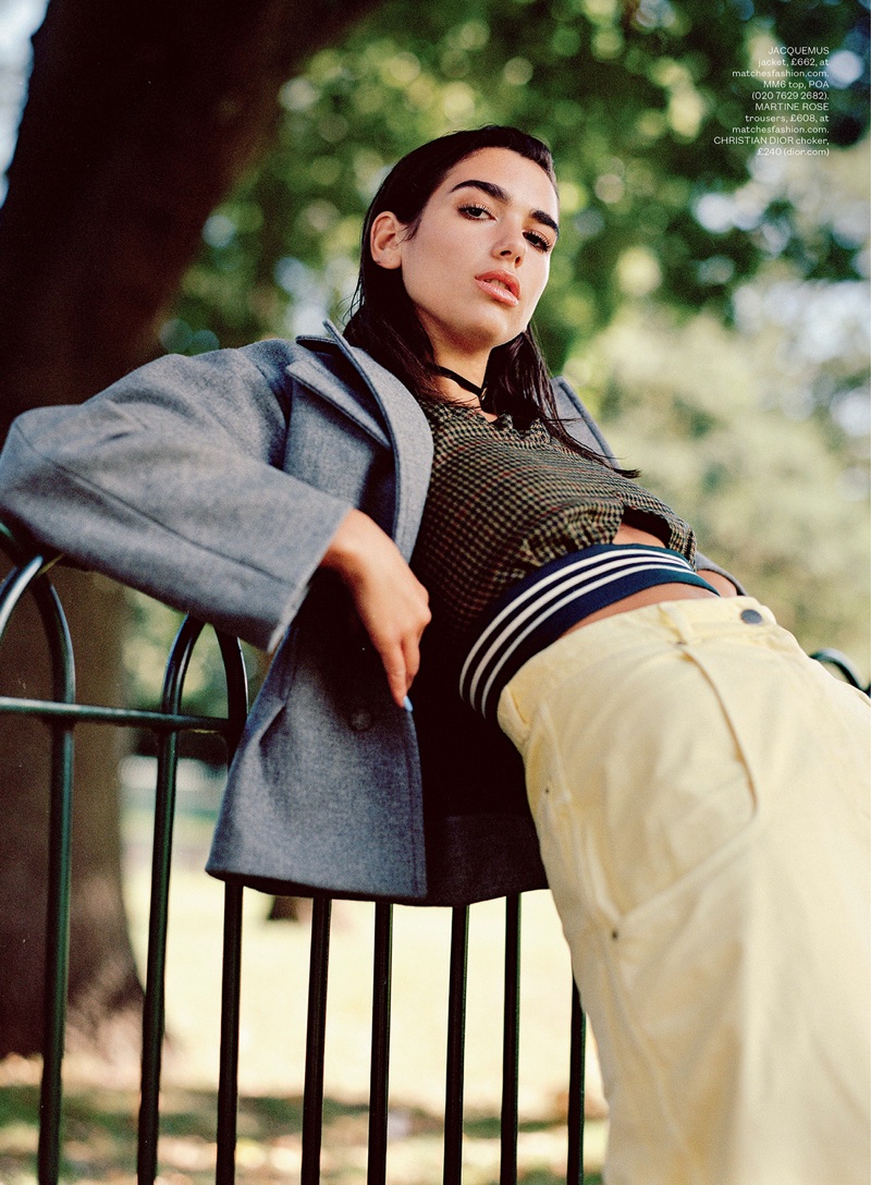 Dua Lipa poses in Jacquemus jacket, MM6 top, Martine Rose trousers and Dior choker