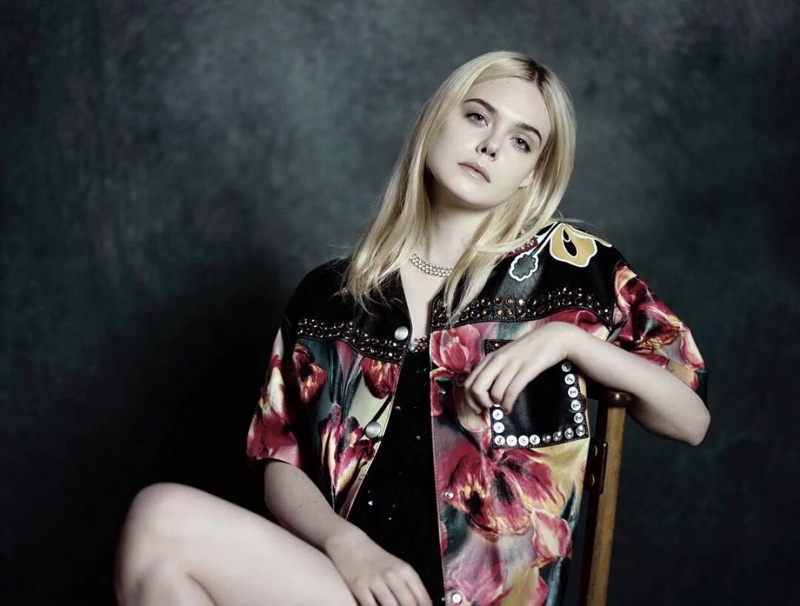 Actress Elle Fanning poses in Miu Miu jacket and dress