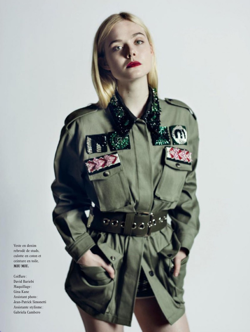 Elle Fanning poses in Miu Miu jacket and shorts