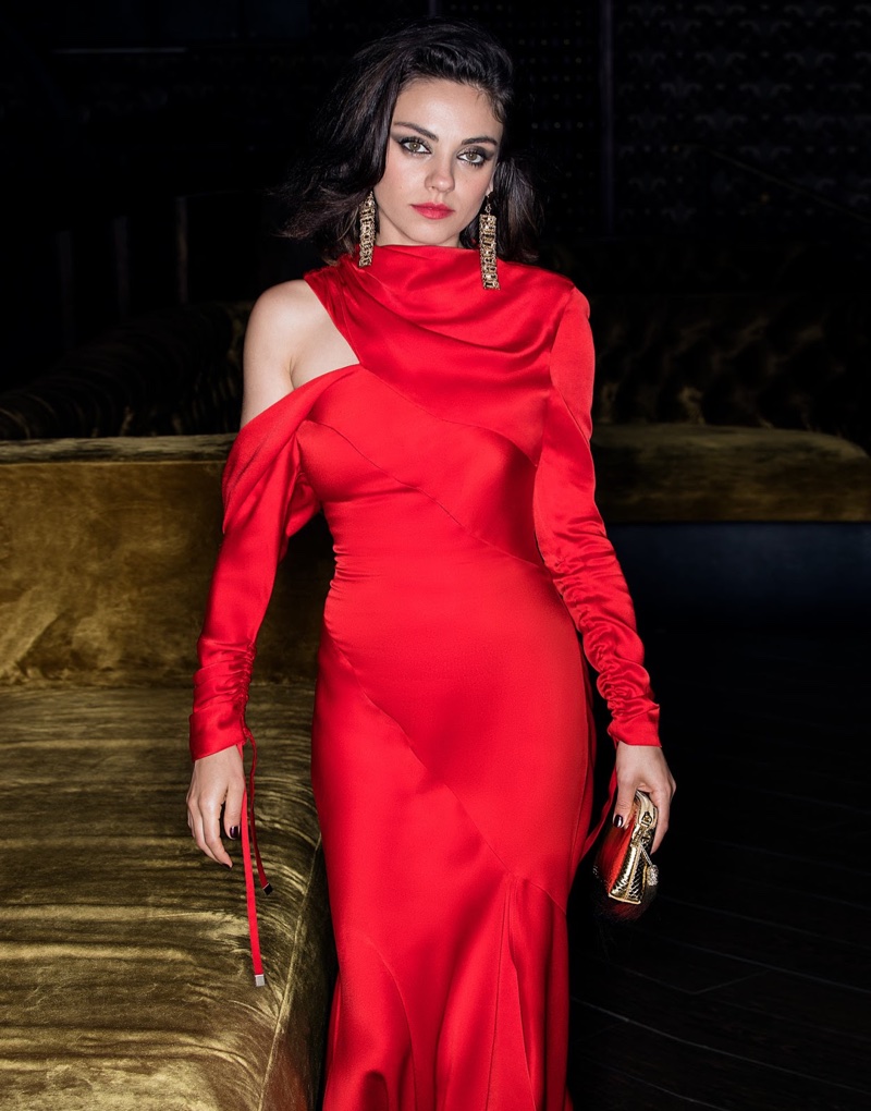 Looking red-hot, Mila Kunis poses in Monse dress, Eddie Borgo earrings and The Row bag