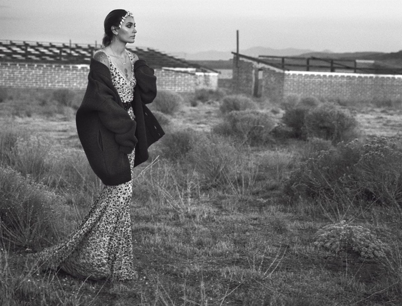 Photographed in black and white, Paris Jackson poses in knit sweater and embroidered gown