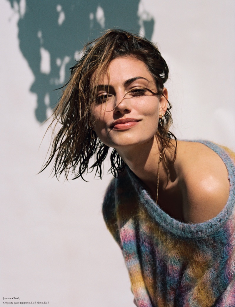 Posing with wet hair, Phoebe Tonkin smiles in multicolored Chloe sweater