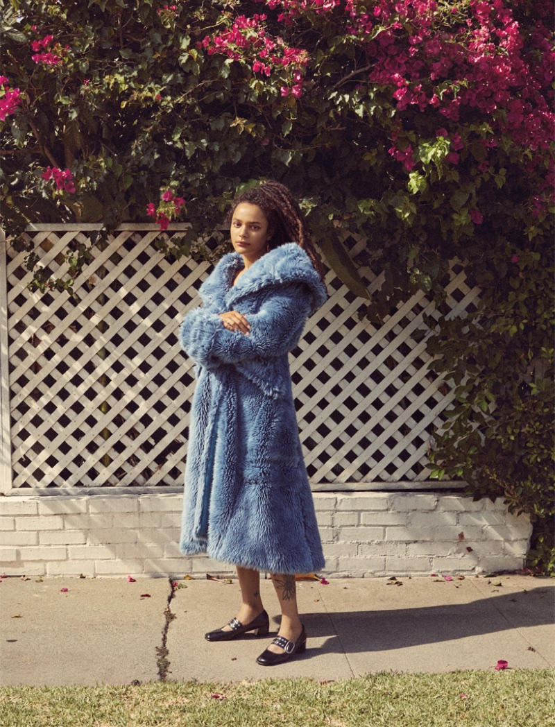 Sasha Lane poses in Miu Miu faux fur coat