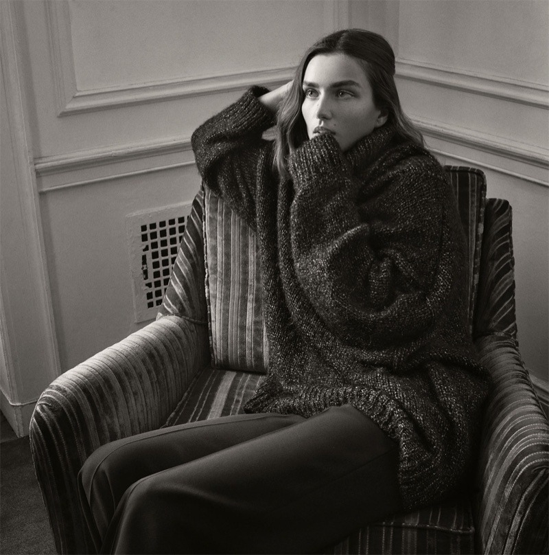 Andreea Diaconu wears Zara oversized shimmer sweater and high-waist trousers