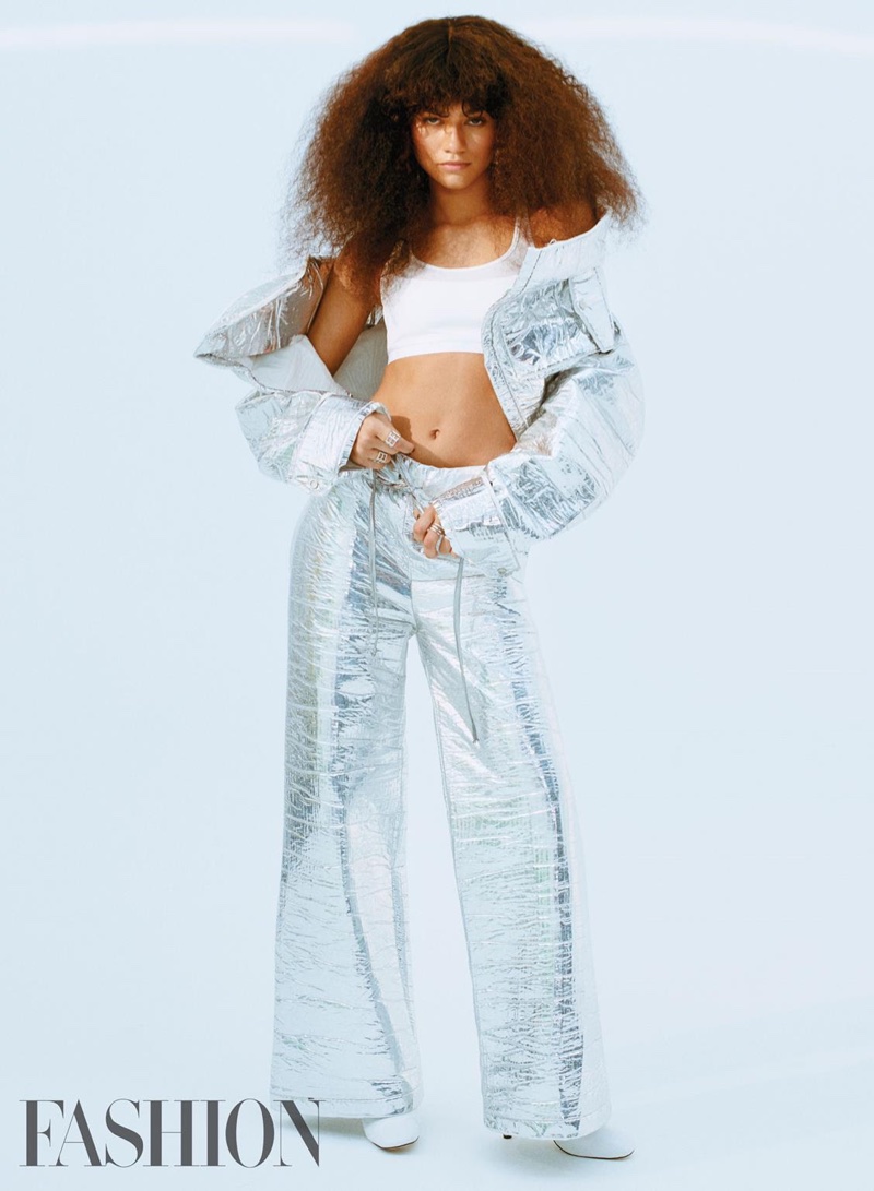 Actress Zendaya poses in silver Off-White jacket and pants with Under Armour top and Kurt Geiger shoes