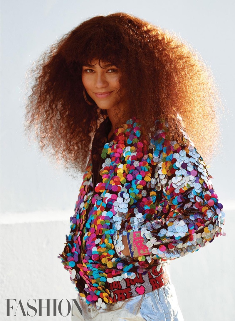 Zendaya poses in paillette embellished jacket from Libertine, Sally LaPointe pants and Jennifer Fisher earrings