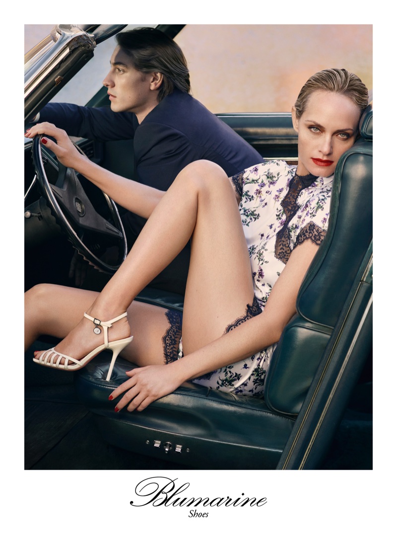 Amber Valletta poses in a car for Blumarine's spring-summer 2018 campaign