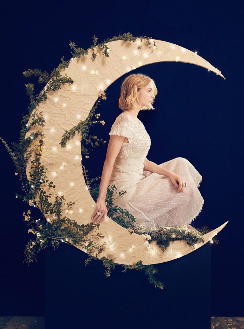 Posing in a crescent moon, Carey Mulligan wears Chanel dress and jewelry