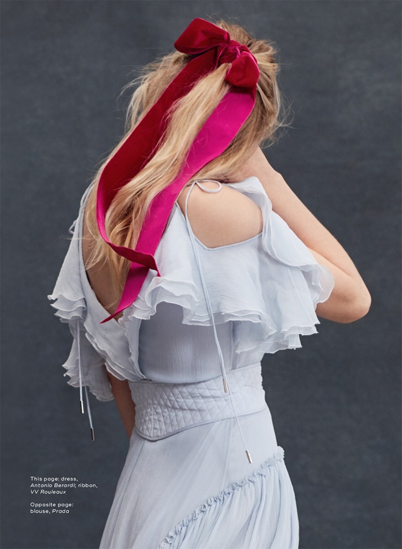 Actress Dakota Fanning poses in Antonio Berardi dress with VV Rouleaux ribbon