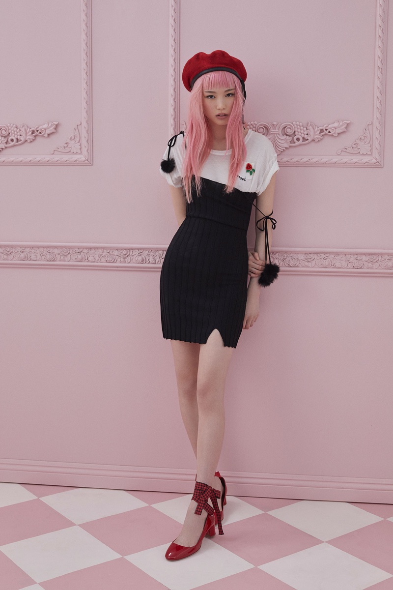 Fernanda Ly poses in little black dress with a t-shirt from For Love & Lemons Knitz