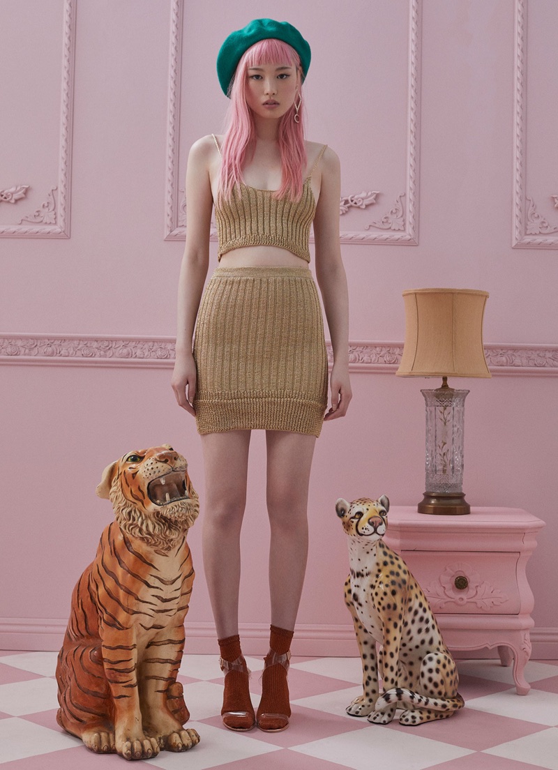 Model Fernanda Ly poses in For Love & Lemons Knitz ribbed knit top and skirt