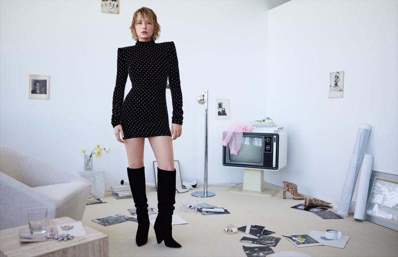 Actress Haley Bennett poses in Saint Laurent dress and boots