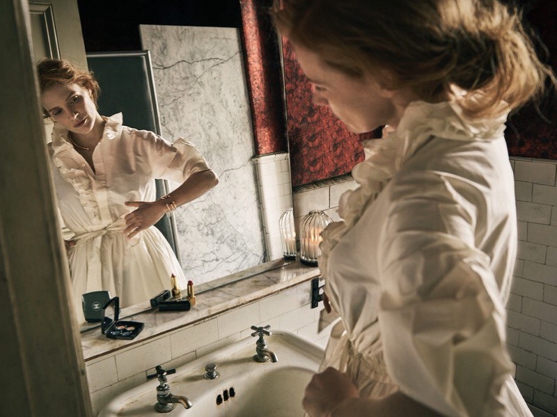 Looking at her reflection, Jessica Chastain poses in Lanvin dress and Piaget jewelry