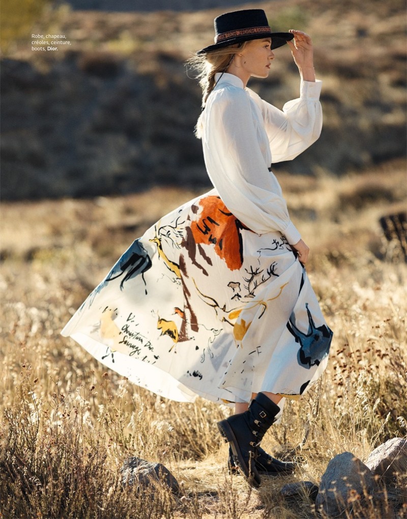 Posing outdoors, Kate Bosworth wears Dior hat, blouse, skirt and boots