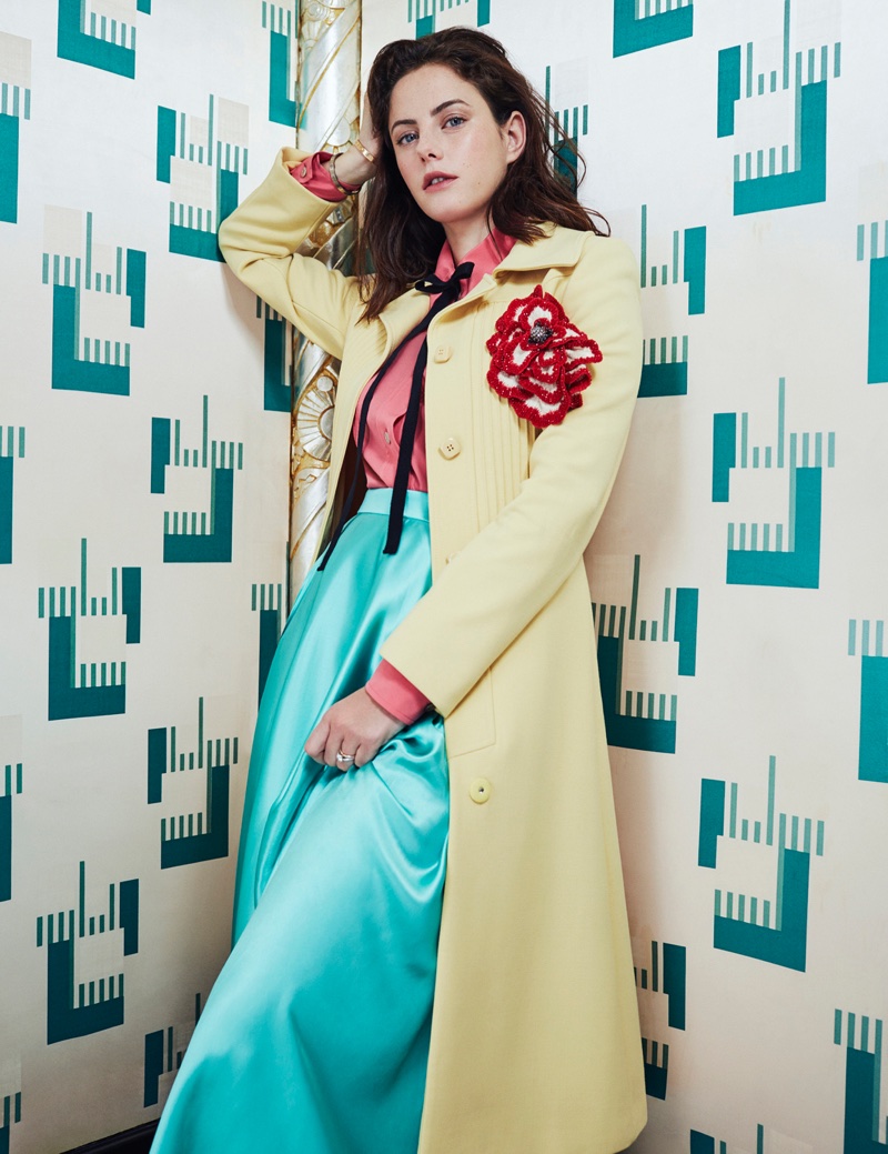 Striking a pose, Kaya Scodelario wears Gucci coat, blouse and skirt