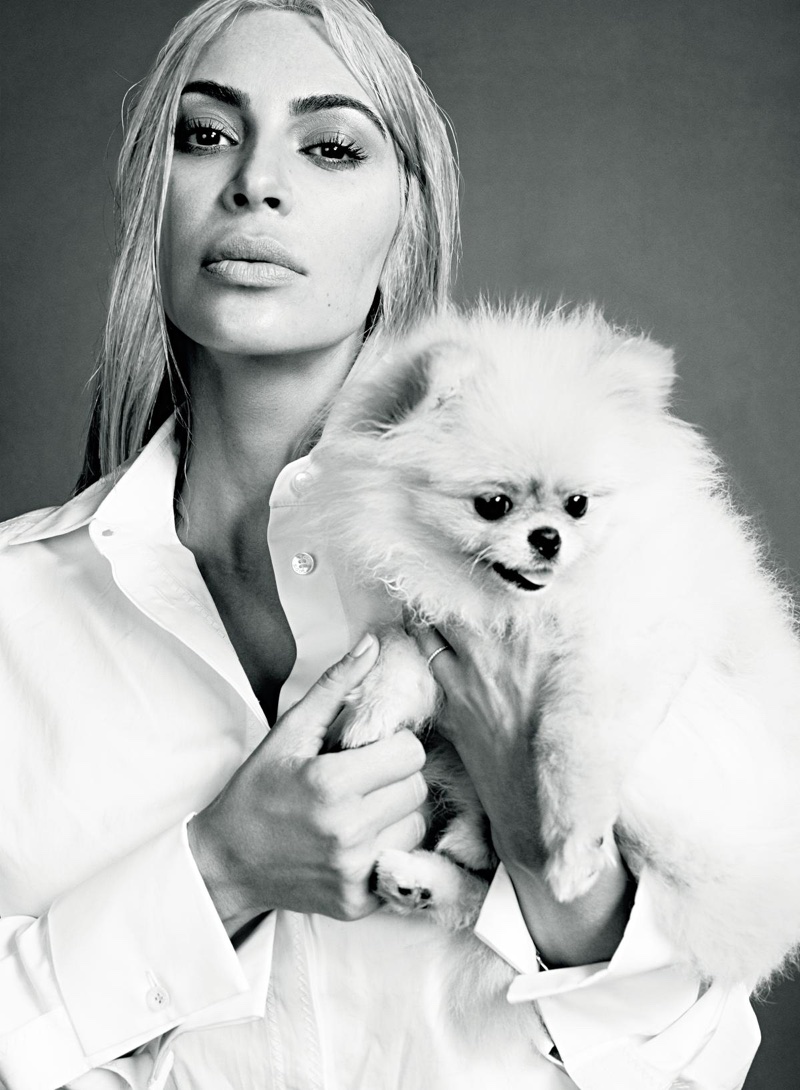 Photographed in black and white, Kim Kardashian wears Tod's men's shirt