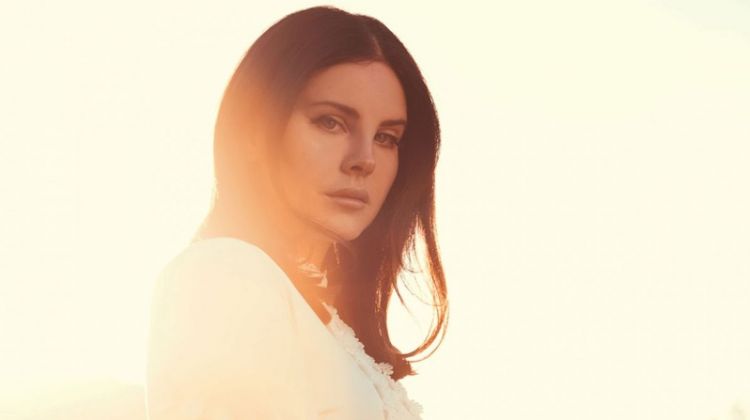 Looking bohemian glam, Lana Del Rey wears white dress