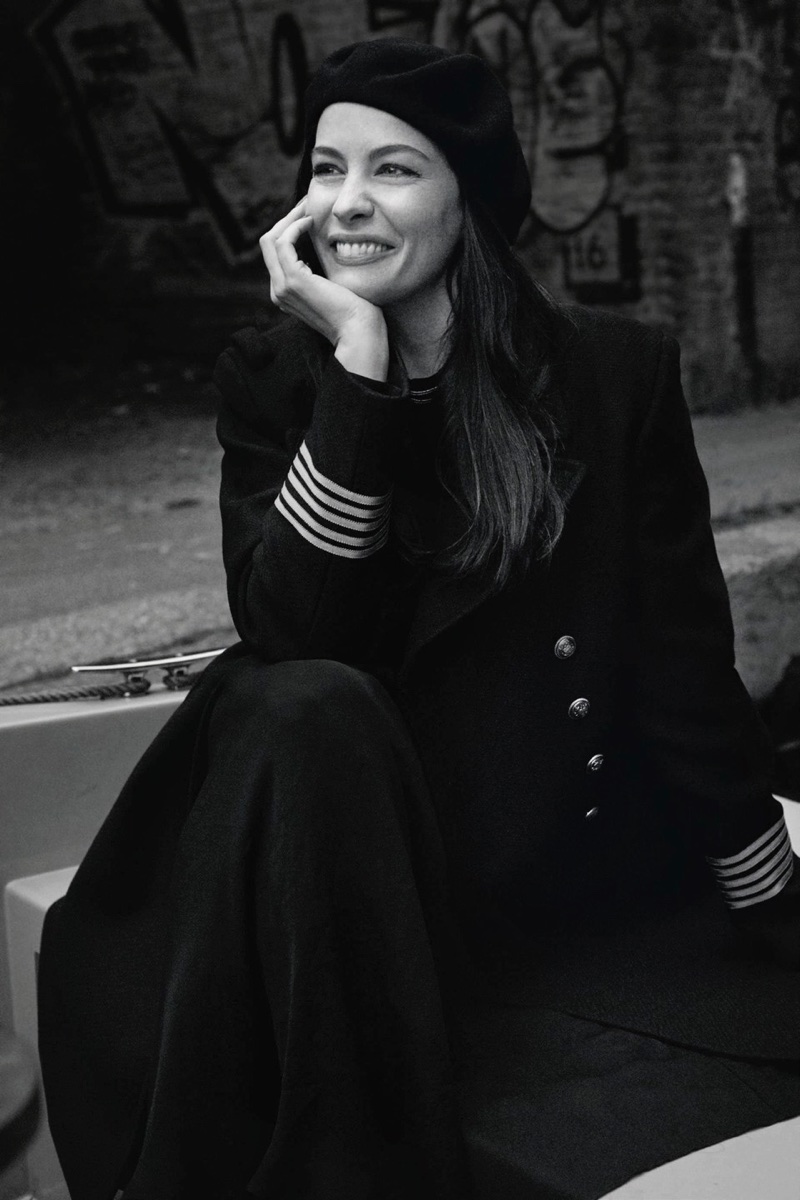 Liv Tyler poses in military inspired jacket for this black and white shot