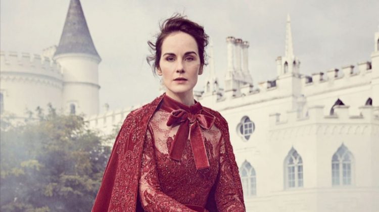 On a horse, Michelle Dockery poses in Elie Saab Haute Couture embroidered dress and cape