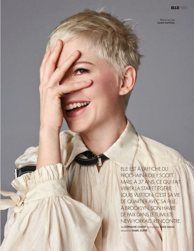 Flashing a smile, Michelle Williams shows off her pixie haircut