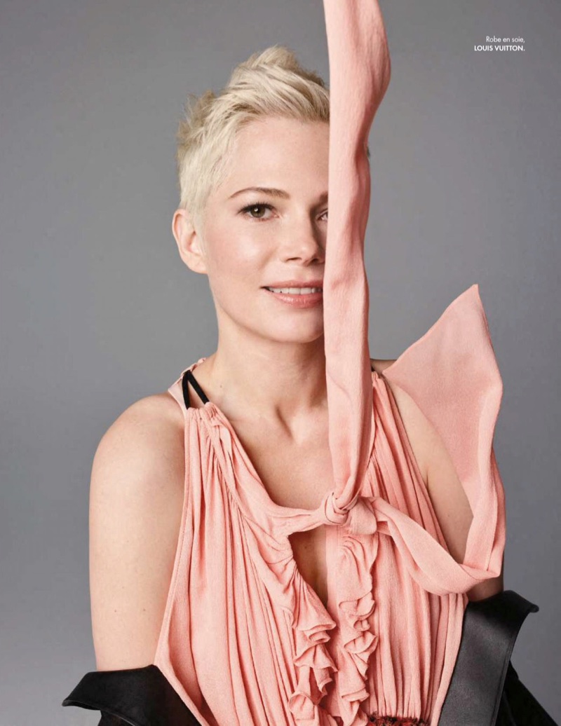 Wearing pink, Michelle Williams poses in Louis Vuitton dress