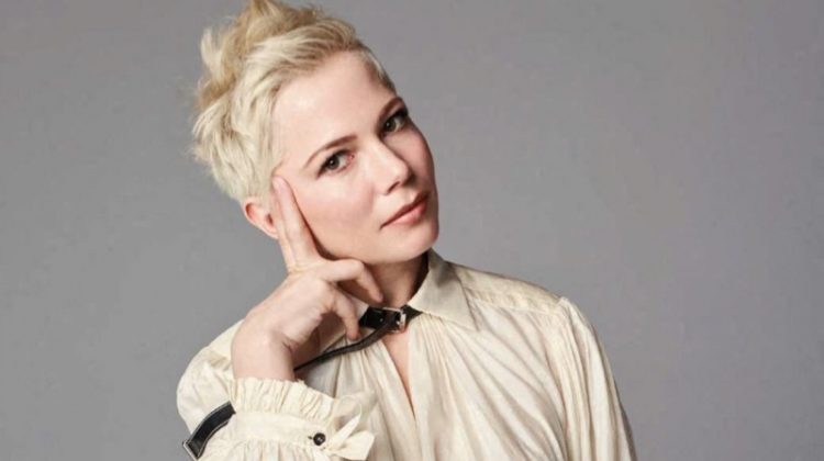 Striking a pose, Michelle Williams wears Louis Vuitton blouse and pants