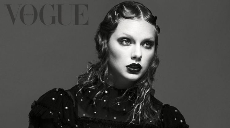 Photographed in black and white, Taylor Swift wears embroidered sweater