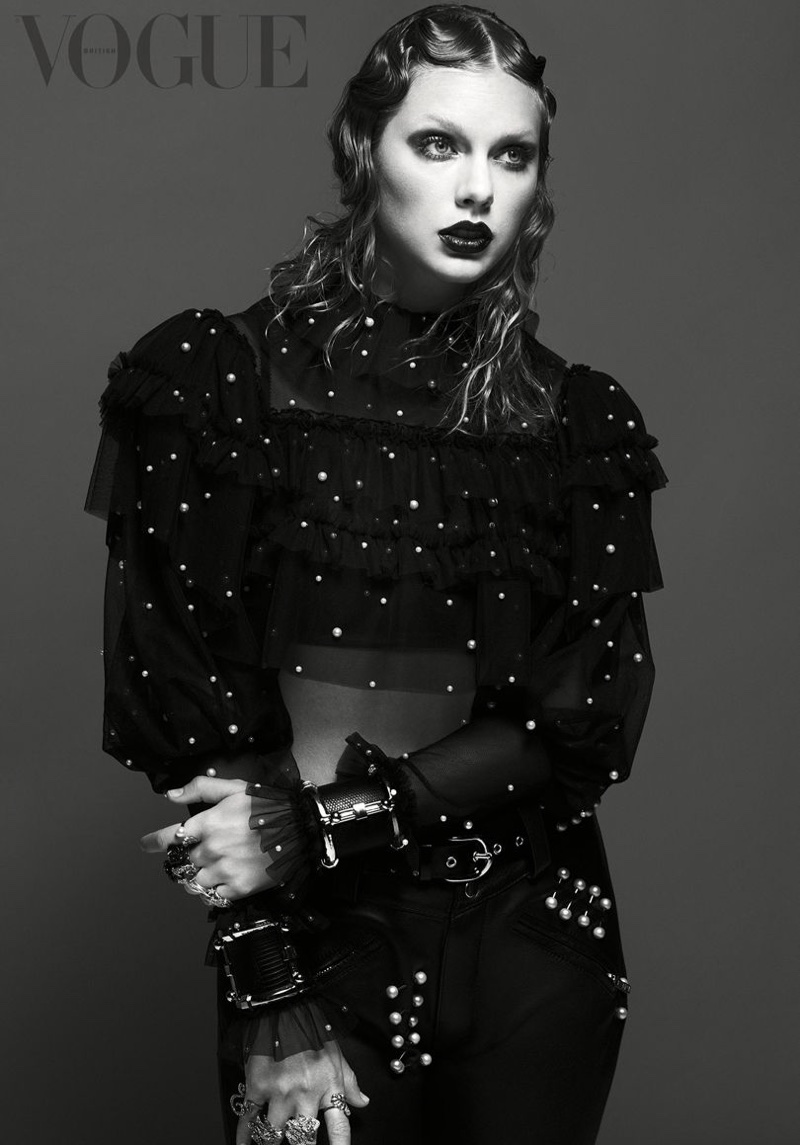 Photographed in black and white, Taylor Swift wears embroidered sweater