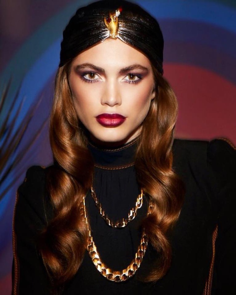 Model Valentina Sampaio wears a bold red lip color from Marc Jacobs Beauty