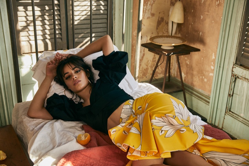 Singer Camila Cabello wears Jennifer Fisher Earrings, Johanna Ortiz top and skirt