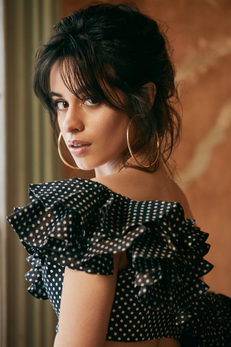Camila Cabello poses in Zimmermann ruffled top and Jennifer Fisher earrings