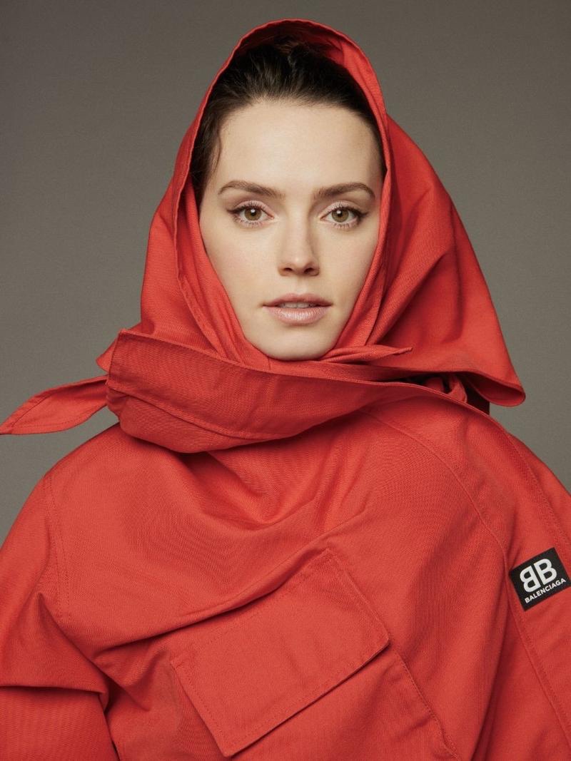 Actress Daisy Ridley poses in red Balenciaga coat